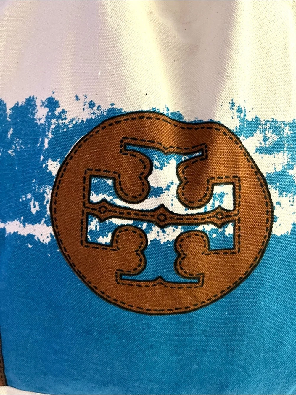 Tory Burch features cream